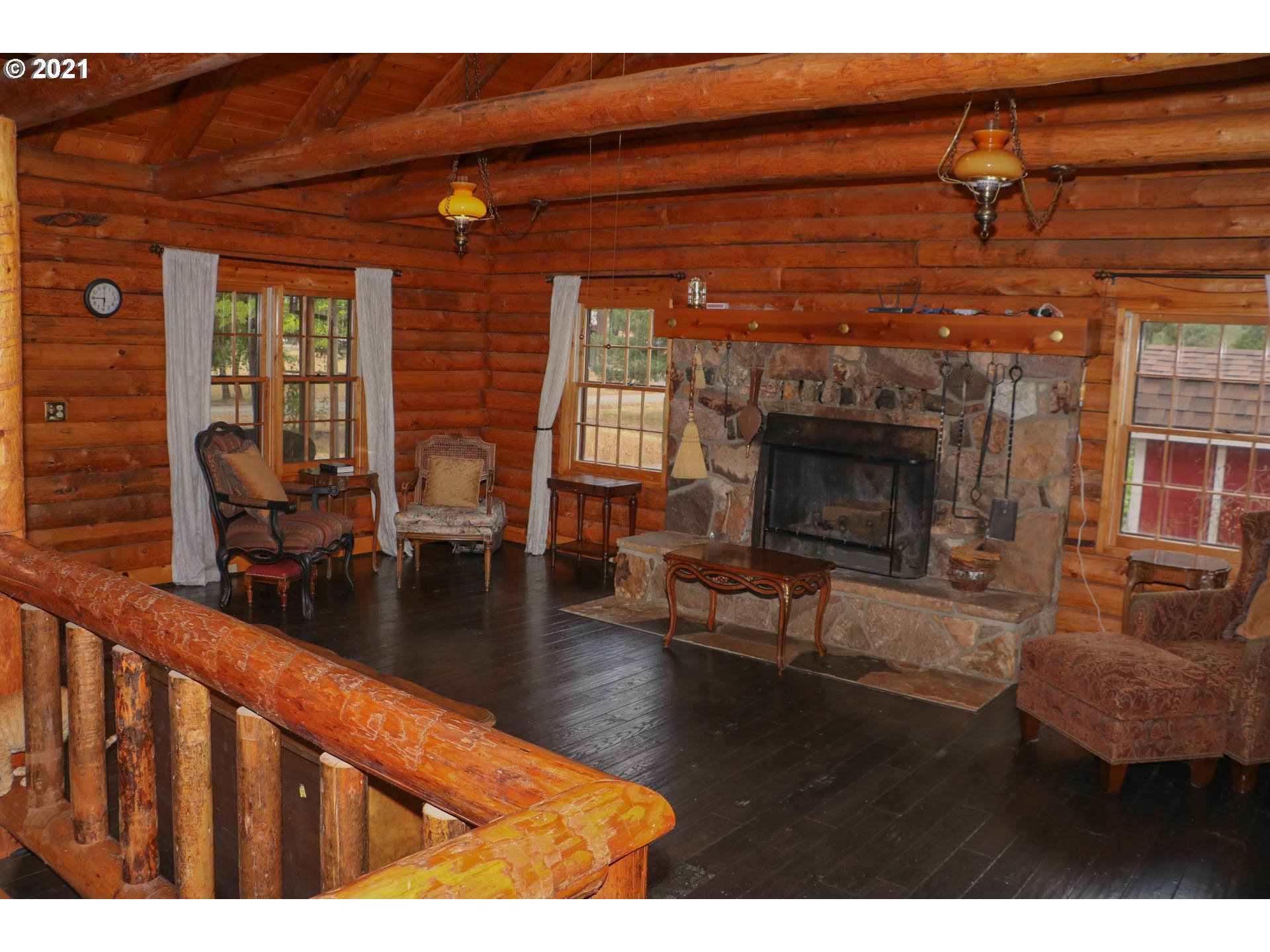 333 Coates Road Tenmile, OR 97481 - Photo 4 of 27 a living room with furniture a window and a fireplace