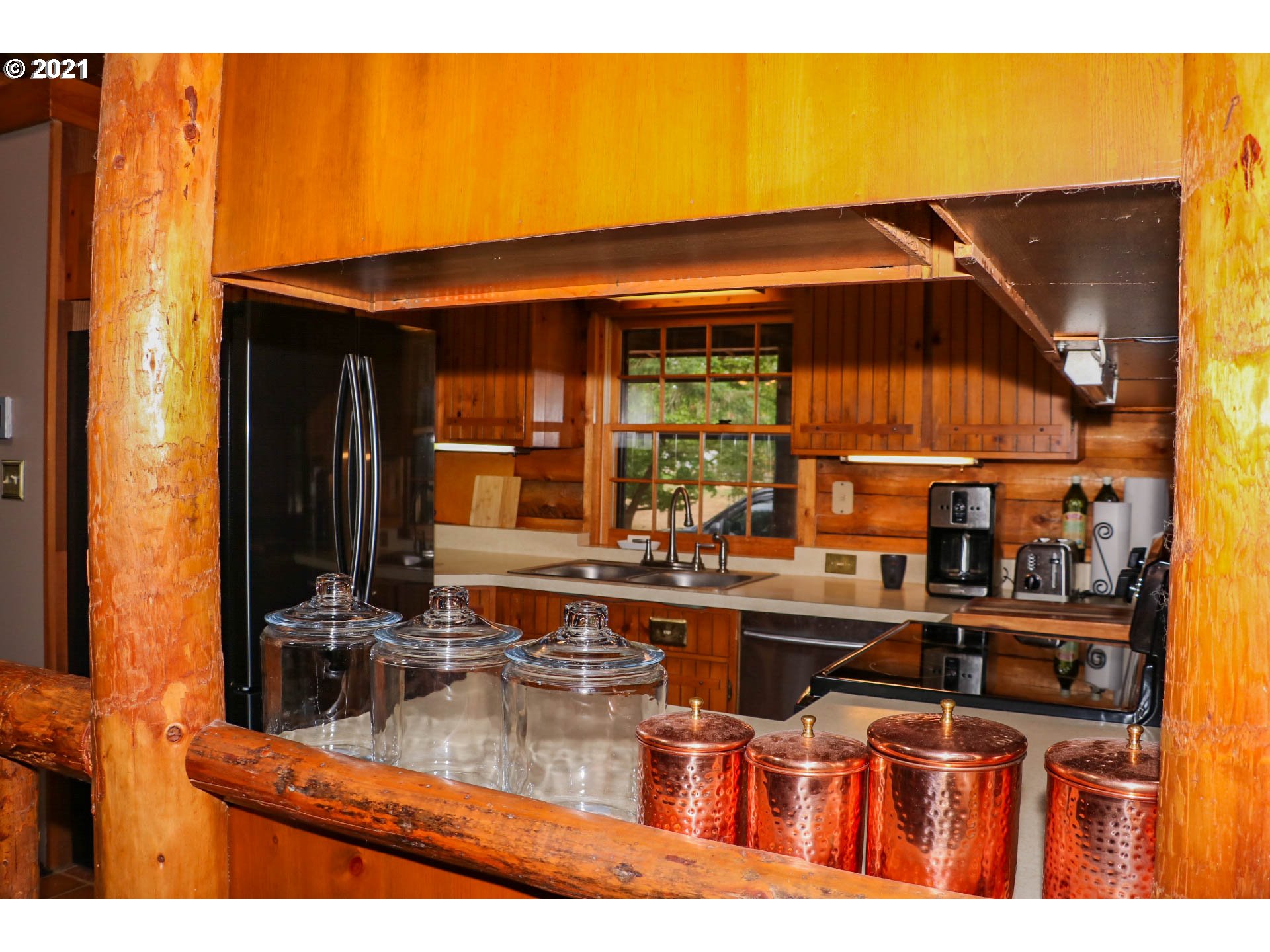 333 Coates Road Tenmile, OR 97481 - Photo 6 of 27 a kitchen with a sink and cabinets