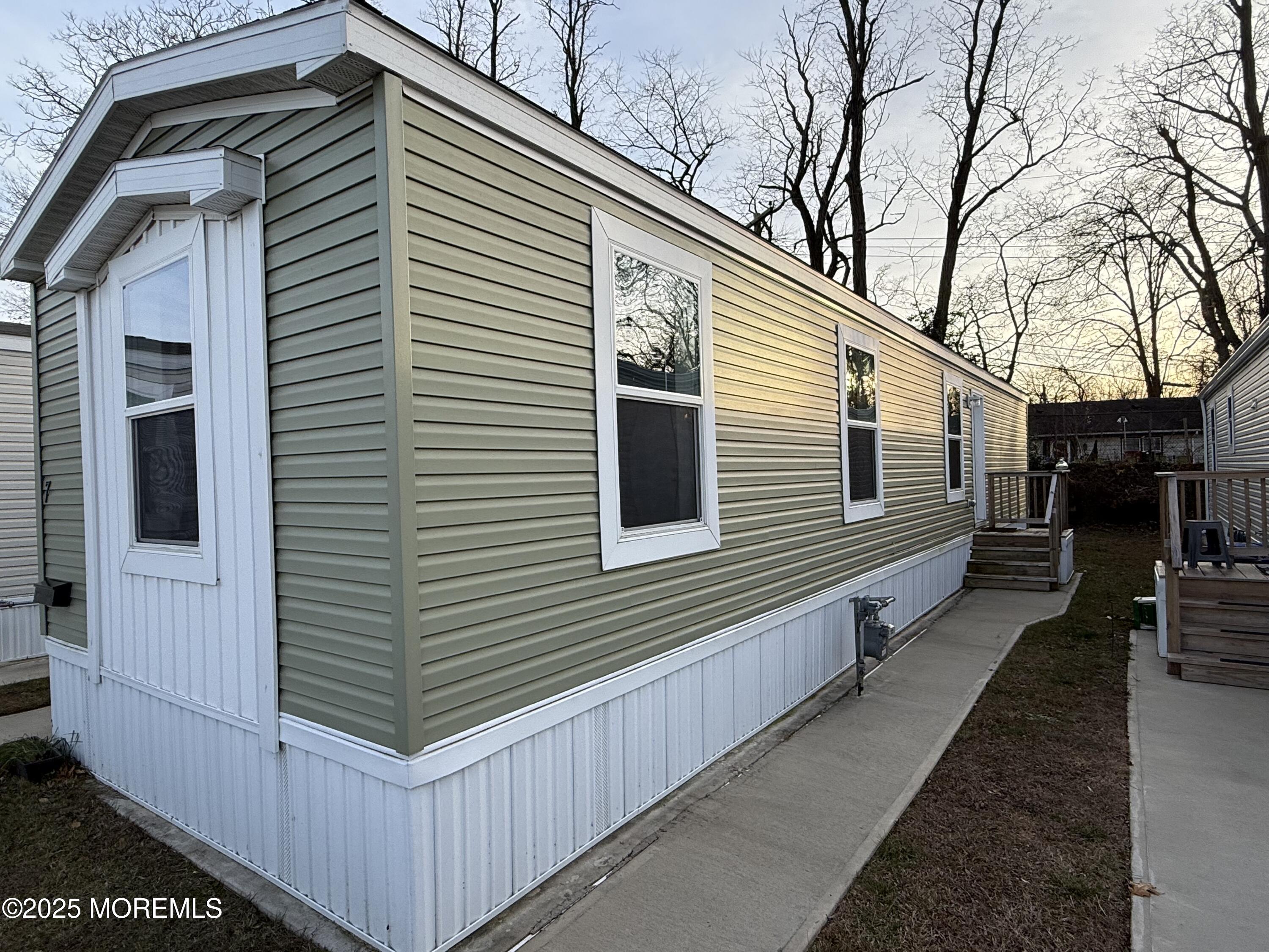 7 John Street Keansburg, NJ 07734 - Photo 14 of 16 a view of a house with a house and a yard