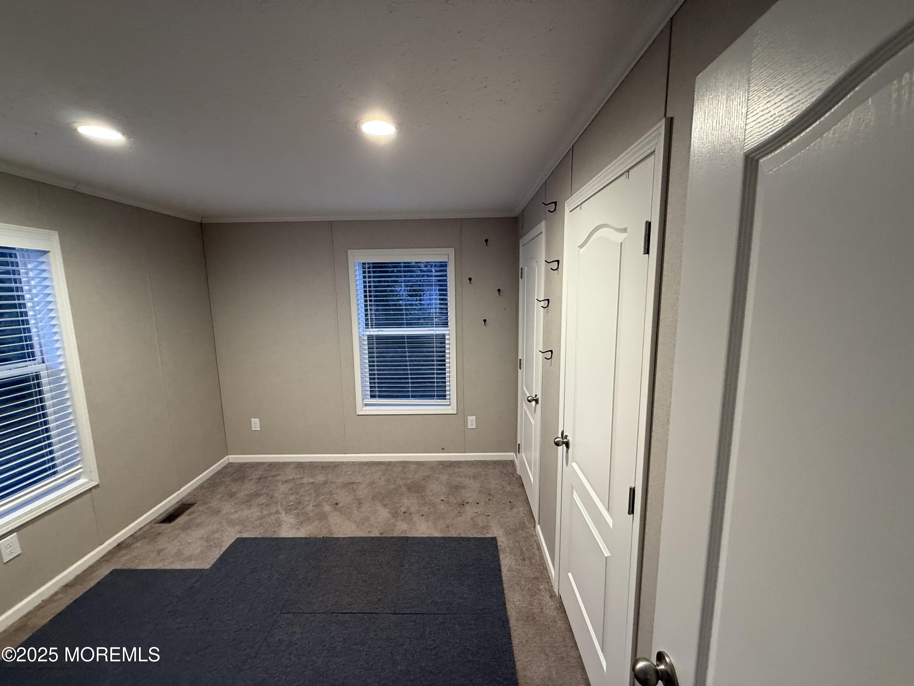 7 John Street Keansburg, NJ 07734 - Photo 8 of 16 an empty room with windows