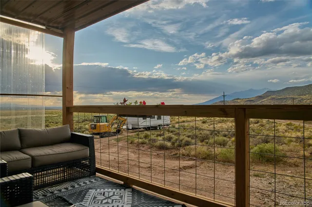 a view of a brick house with large windows