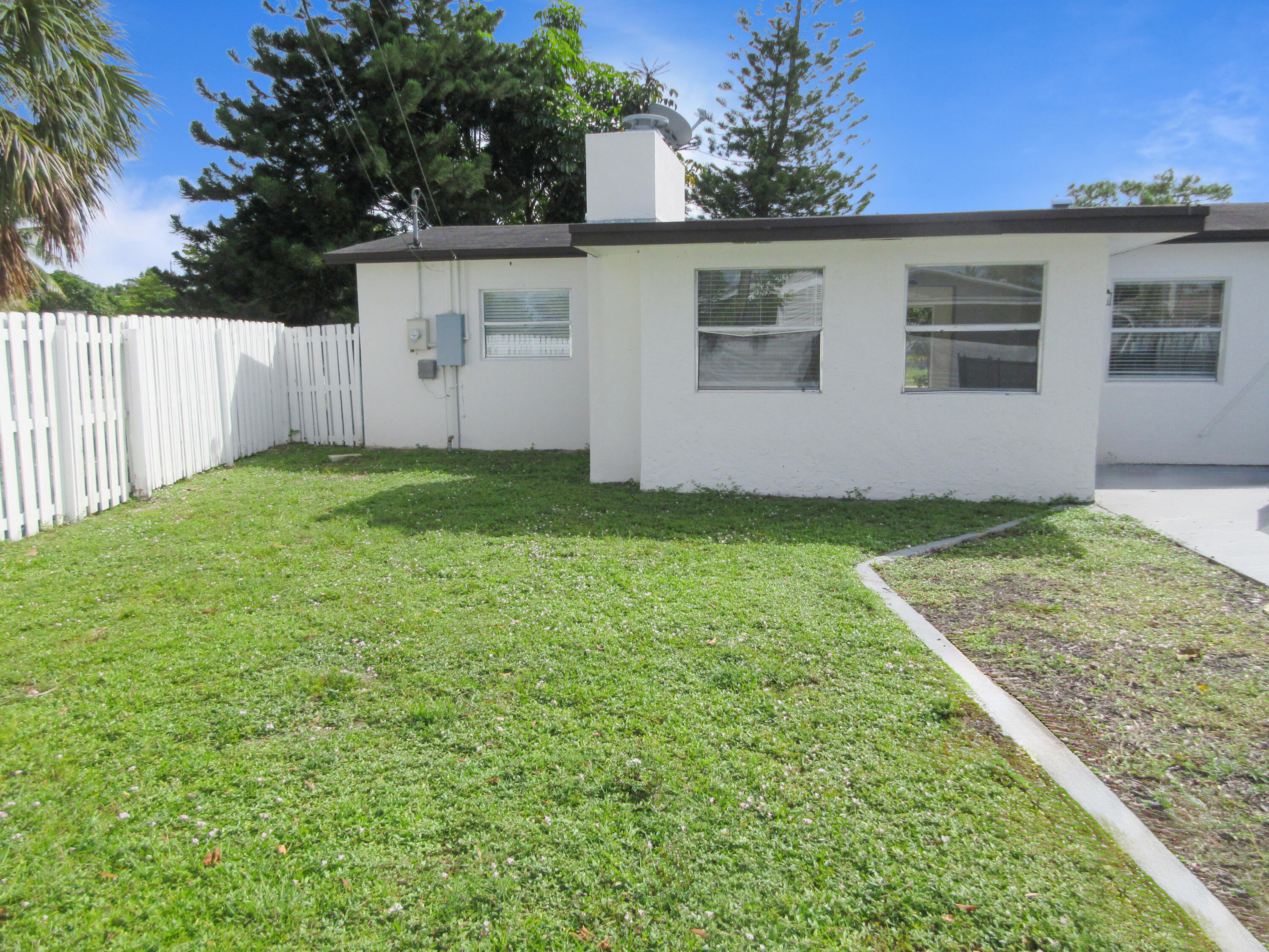 3801 Northwest 6th Street Lauderhill, FL 33311 - Photo 12 of 13 a view of a backyard with a garden
