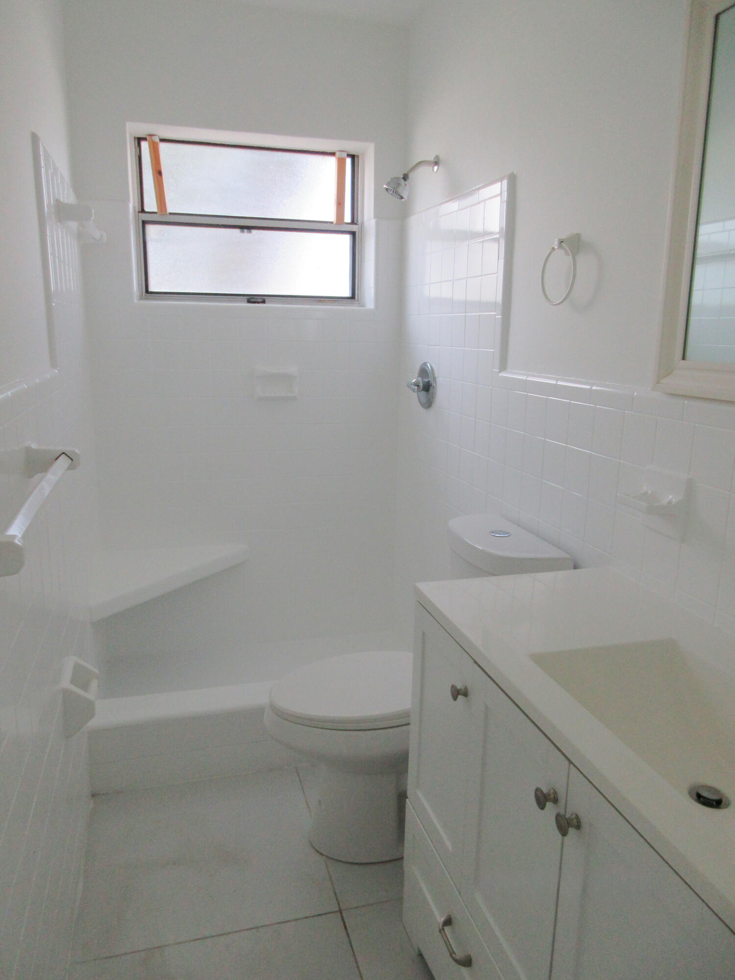 3801 Northwest 6th Street Lauderhill, FL 33311 - Photo 8 of 13 a bathroom with a sink a toilet and shower