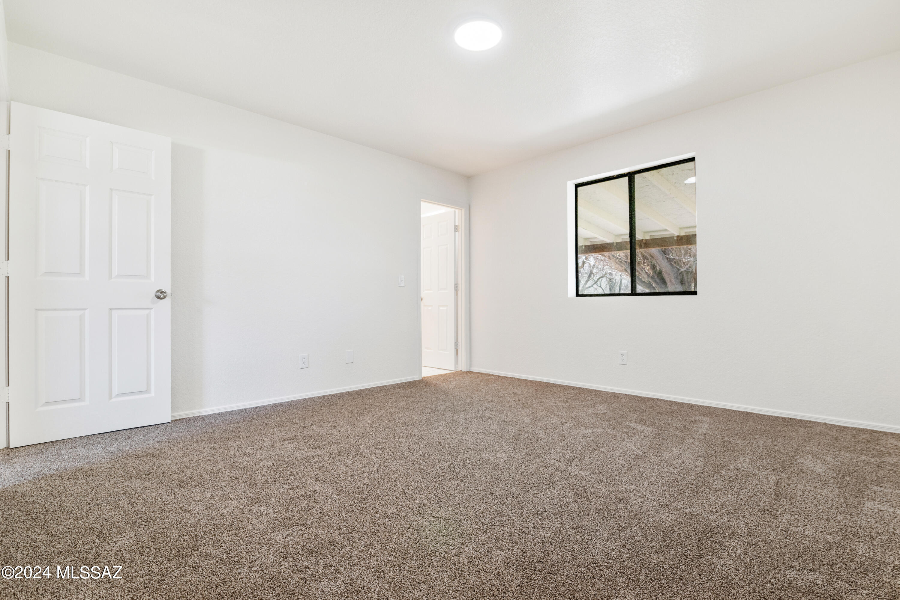 273 Harpo Court Rio Rico, AZ 85648 - Photo 24 of 34 an empty room with windows and closet