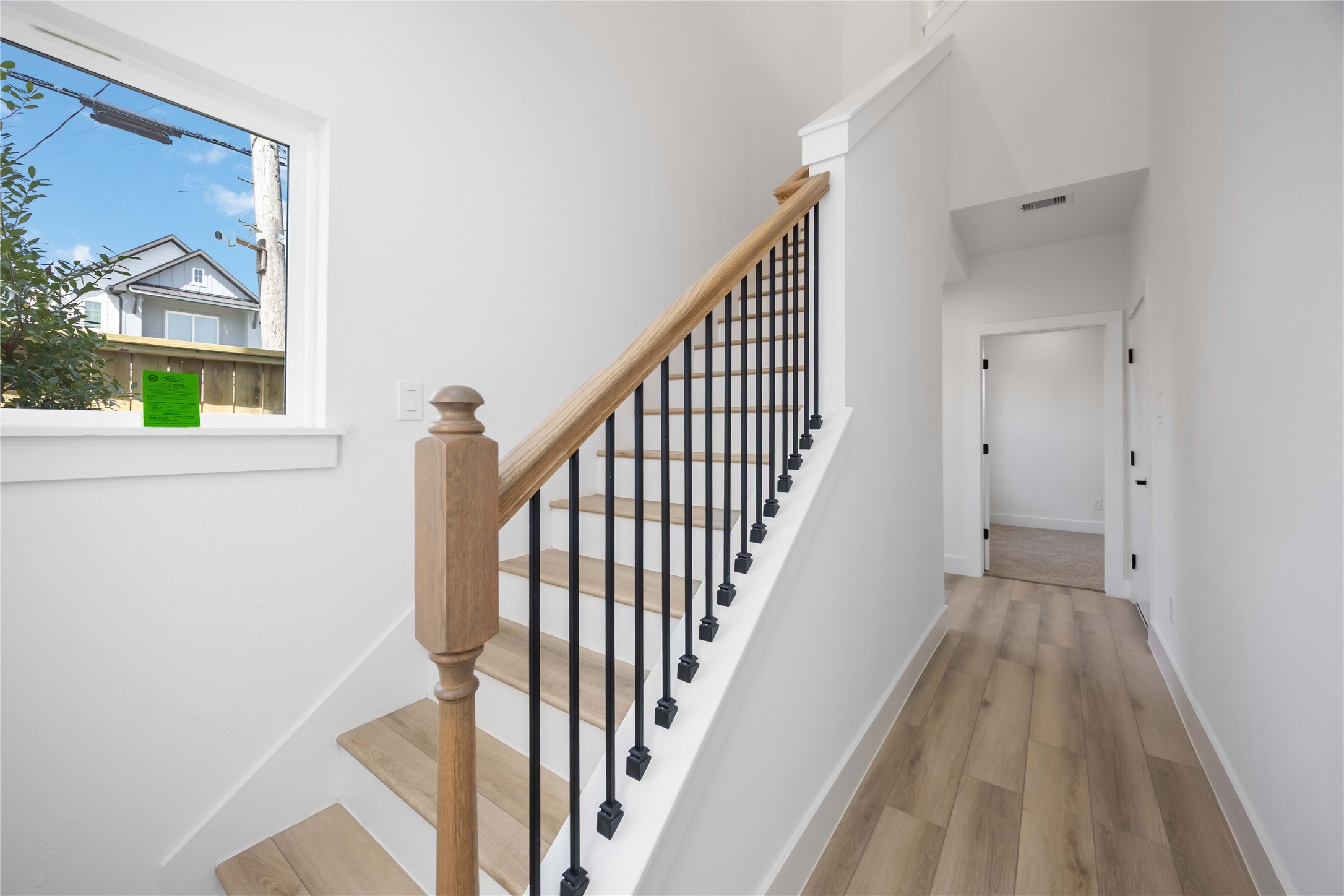 6735 Peerless Street, Unit C Houston, TX 77021 - Photo 9 of 27 a view of a hallway with wooden floor and staircase