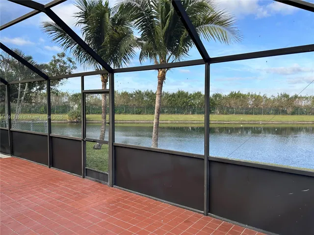 a view of hallway with wooden floor