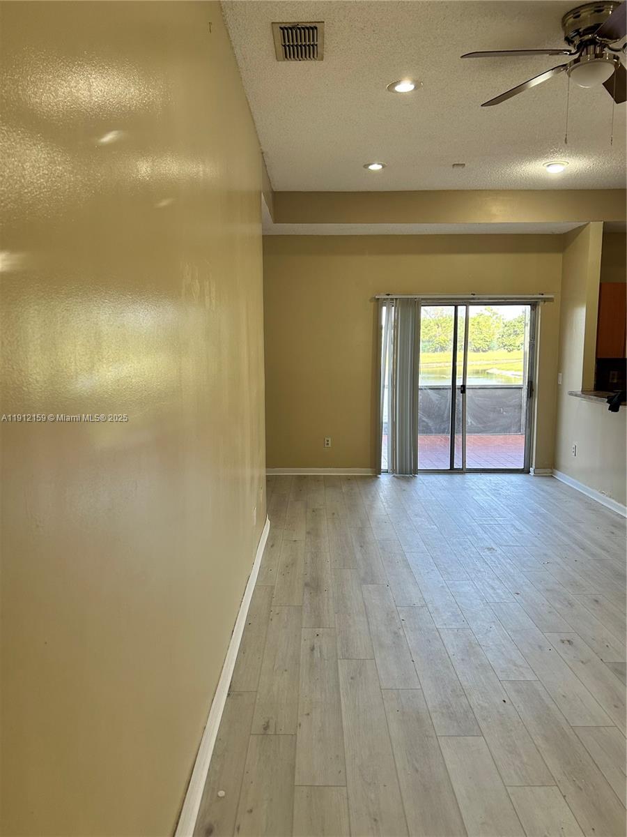 1111 Southwest 84th Terrace Pembroke Pines, FL 33025 - Photo 4 of 11 a view of hallway with wooden floor