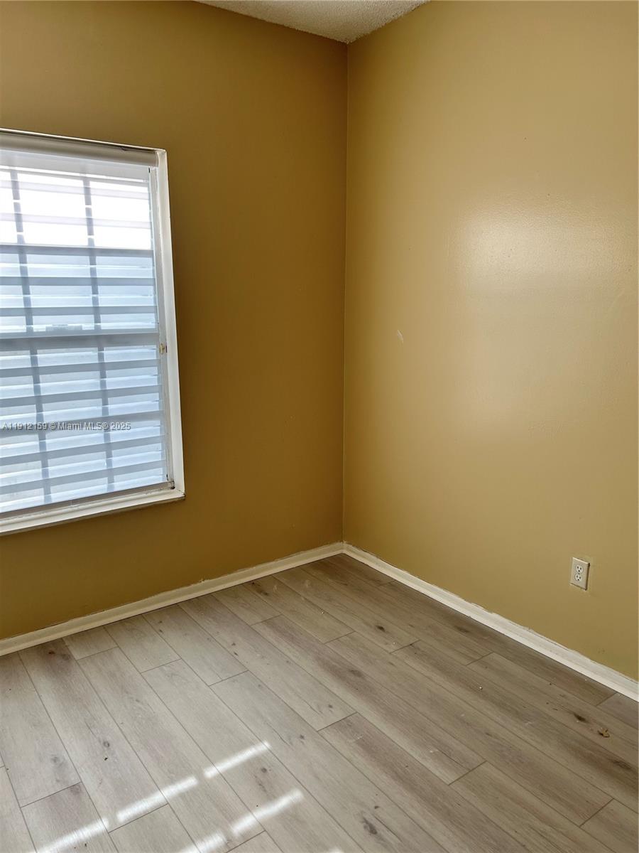1111 Southwest 84th Terrace Pembroke Pines, FL 33025 - Photo 6 of 11 an empty room with a window