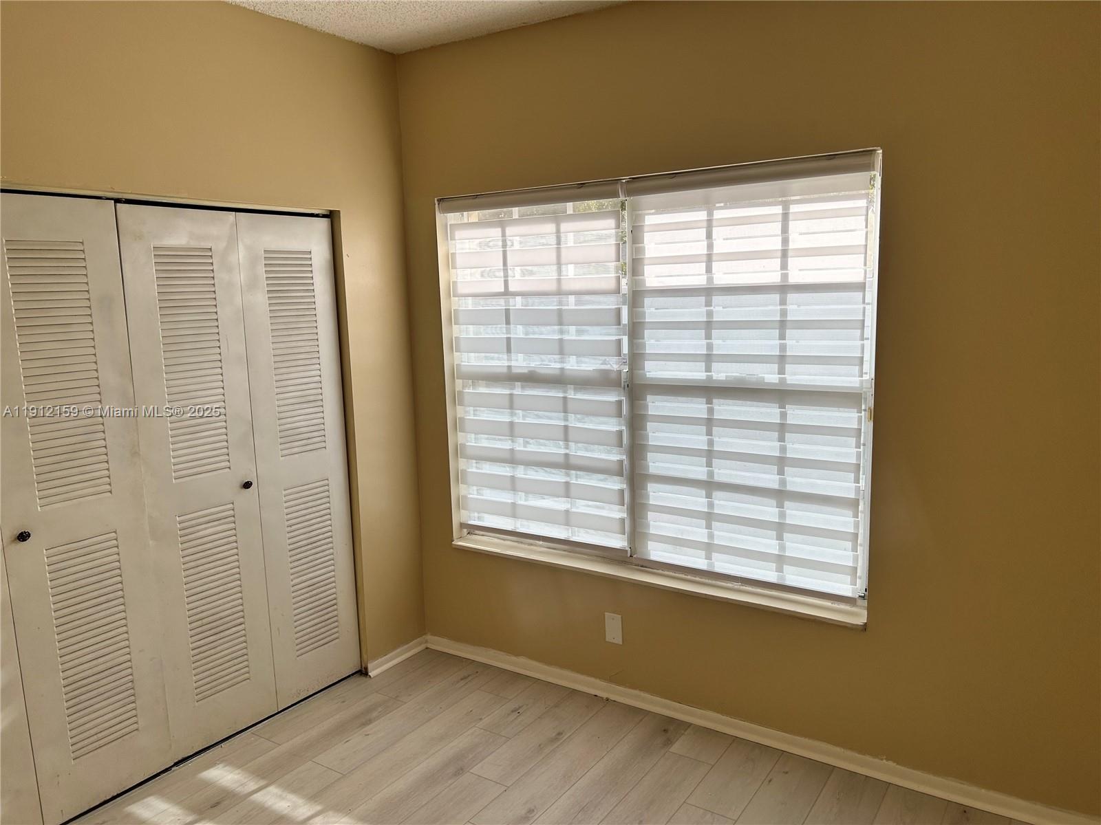 1111 Southwest 84th Terrace Pembroke Pines, FL 33025 - Photo 7 of 11 an empty room with windows