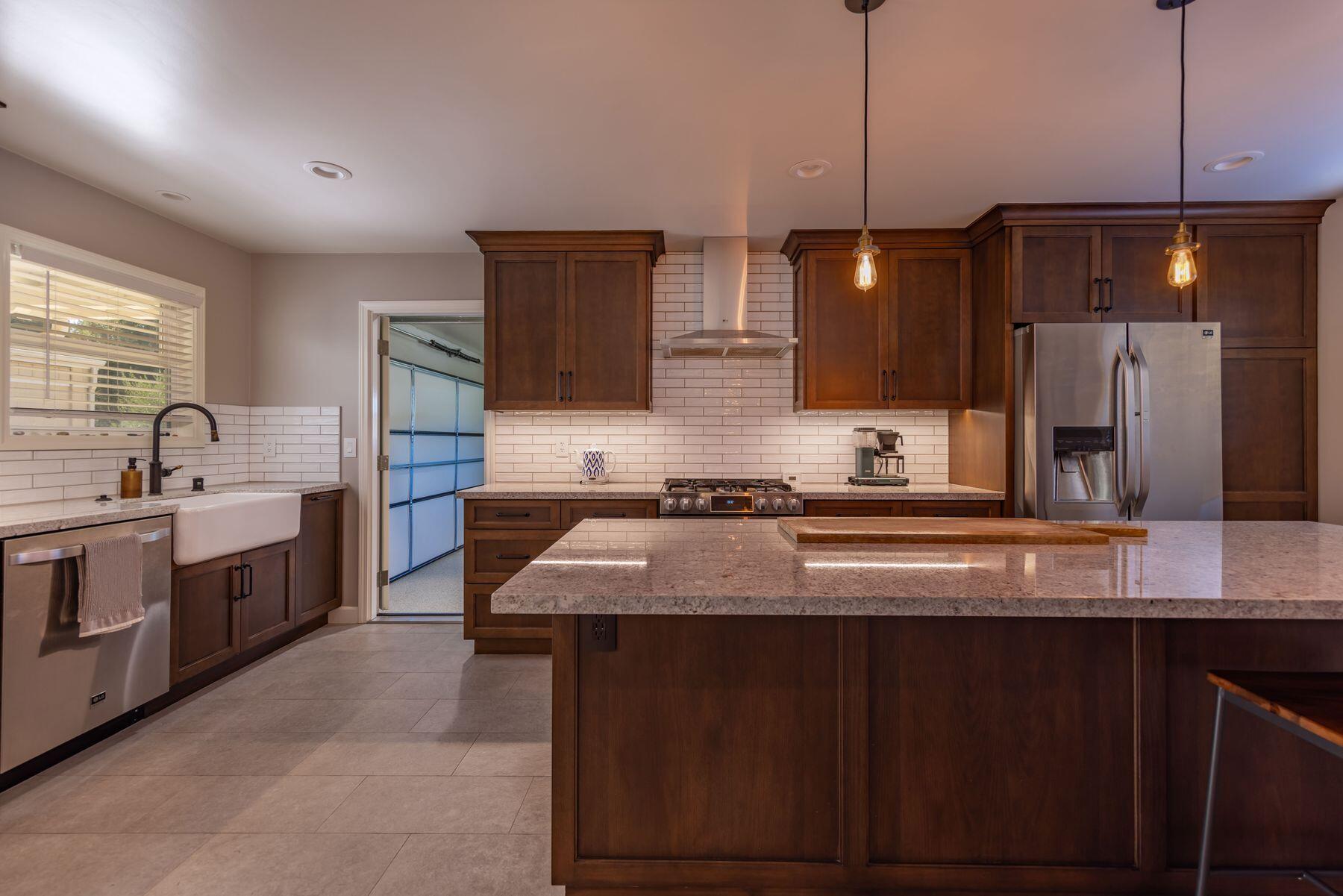 351 Sunset Avenue Oak View, CA 93022 - Photo 14 of 39 a kitchen with stainless steel appliances granite countertop a sink a stove and a refrigerator