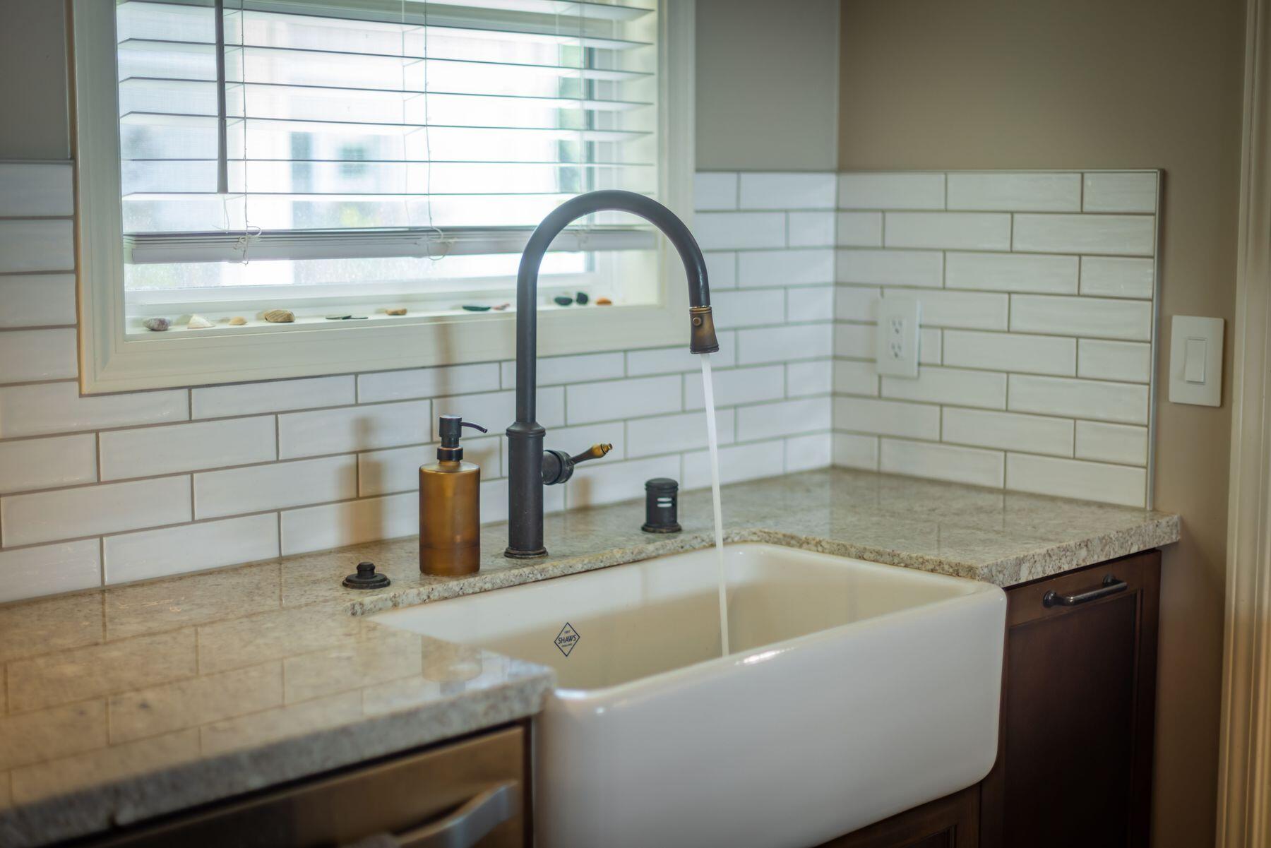 351 Sunset Avenue Oak View, CA 93022 - Photo 16 of 39 a bathroom with a granite countertop sink and a window