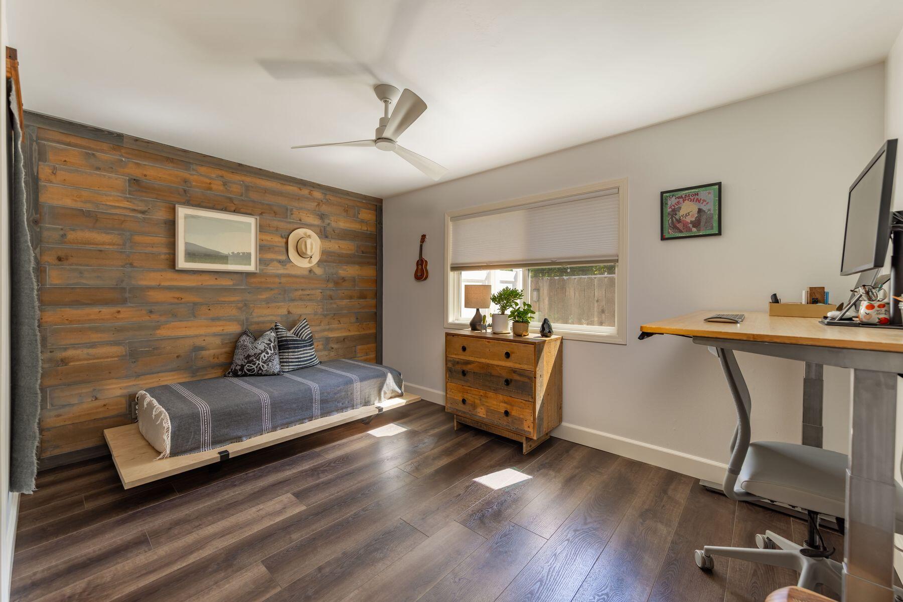 351 Sunset Avenue Oak View, CA 93022 - Photo 32 of 39 a bedroom with furniture and a wooden floor