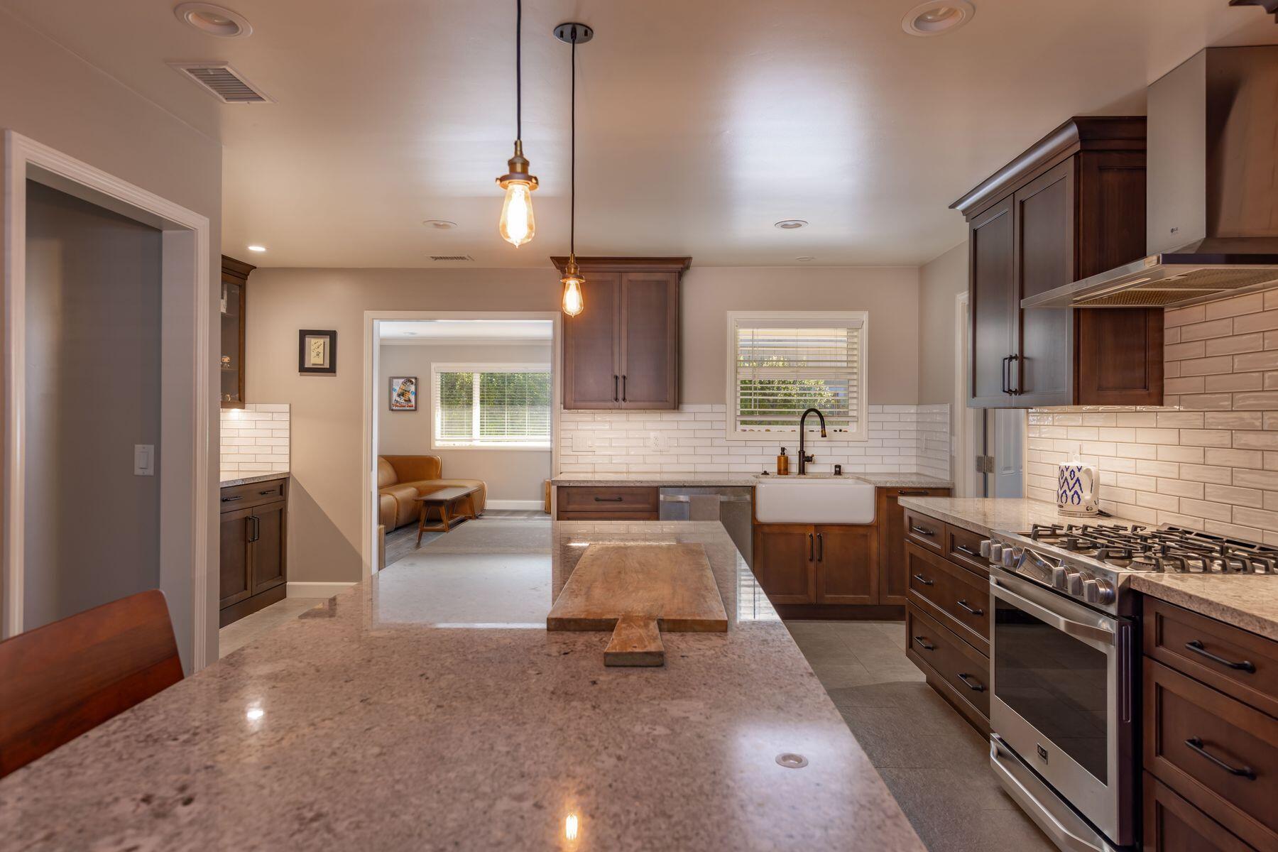 351 Sunset Avenue Oak View, CA 93022 - Photo 6 of 39 a large kitchen with stainless steel appliances a large counter top a stove and a refrigerator
