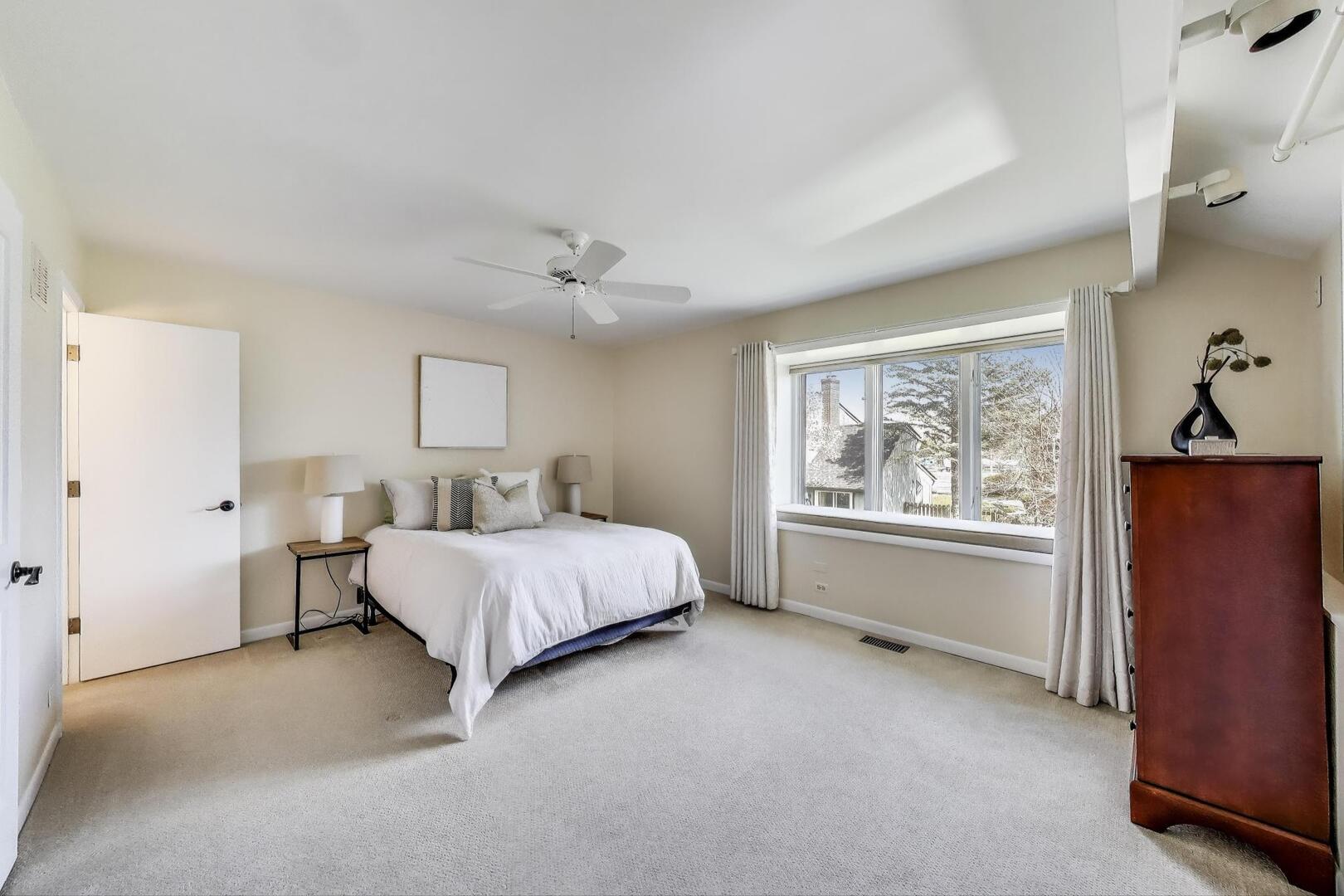 189 North Happ Road Northfield, IL 60093 - Photo 25 of 43 a bed room with a bed and a window