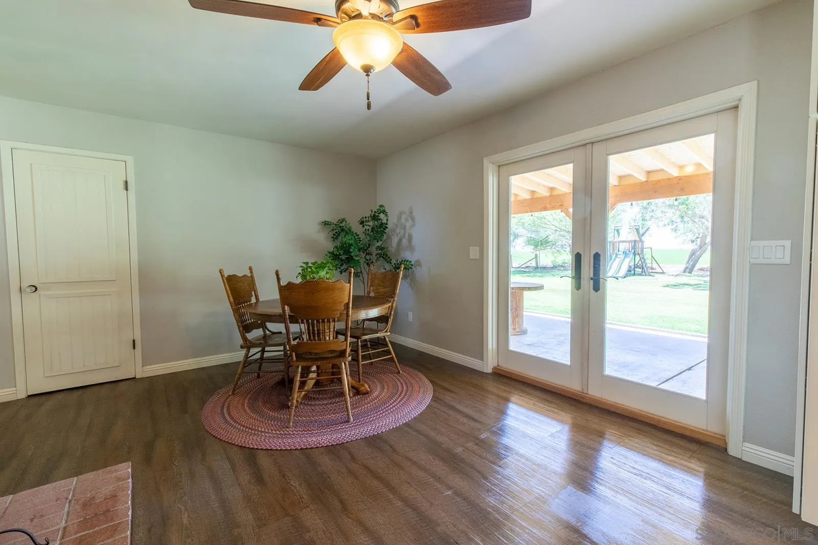 5754 Brandt Road Brawley, CA 92227 - Photo 18 of 48 a view of a dining room with furniture wooden floor and chandelier