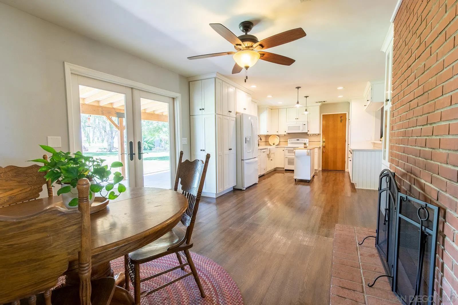 5754 Brandt Road Brawley, CA 92227 - Photo 19 of 48 a view of a dining room with furniture window and wooden floor
