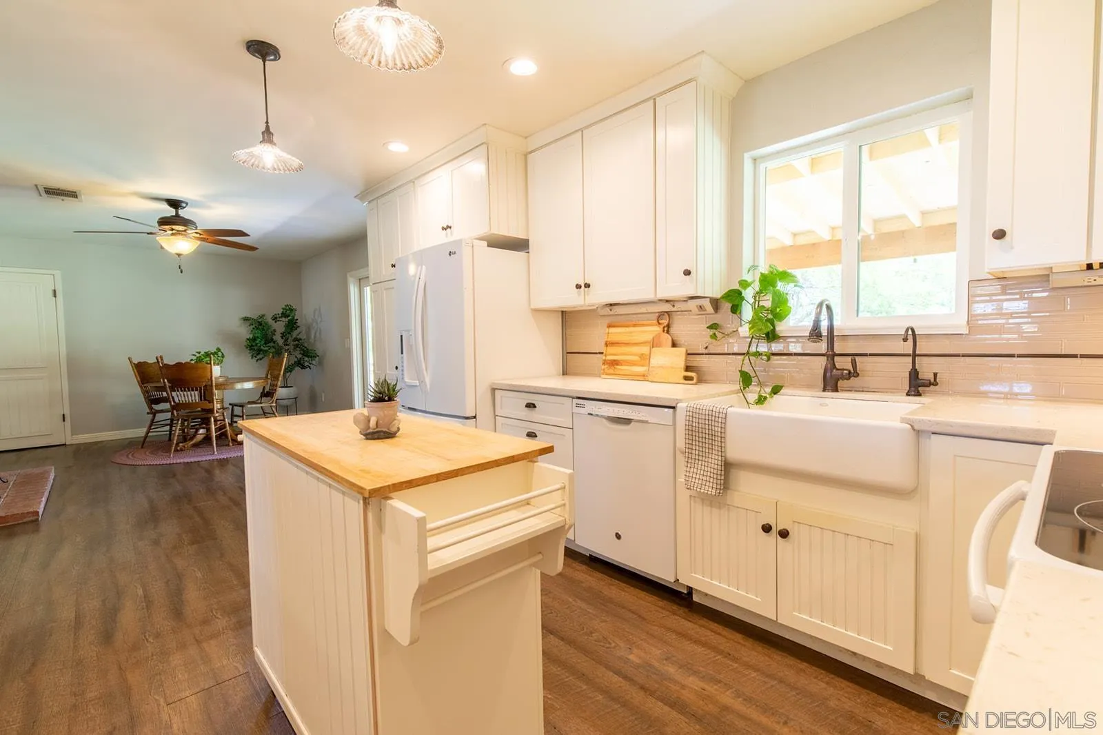 5754 Brandt Road Brawley, CA 92227 - Photo 21 of 48 a kitchen that has a lot of cabinets in it and wooden floor