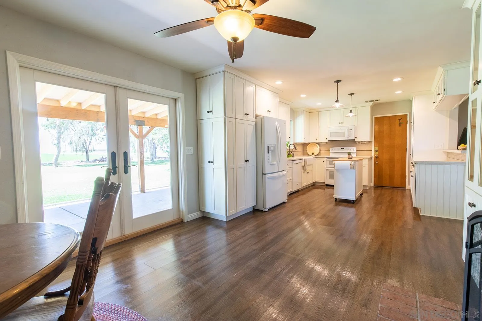 5754 Brandt Road Brawley, CA 92227 - Photo 26 of 48 a view of a kitchen with refrigerator and wooden floor