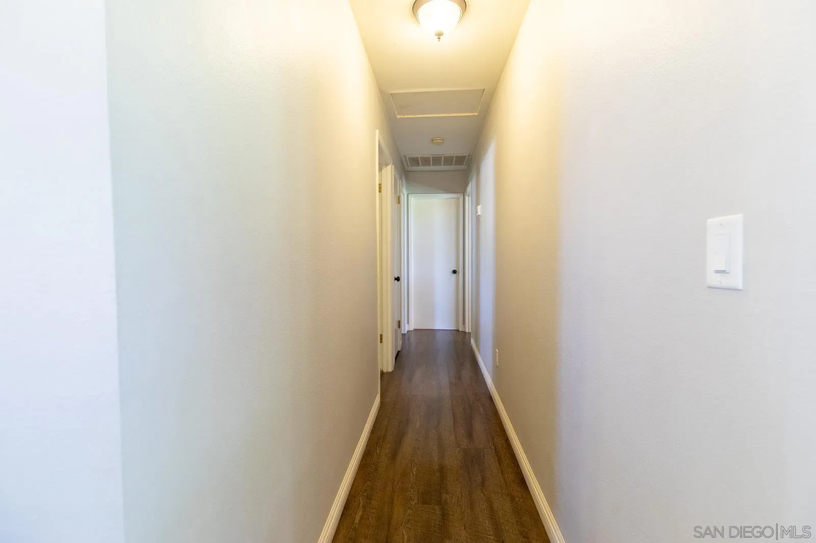 5754 Brandt Road Brawley, CA 92227 - Photo 27 of 48 a view of a hallway with wooden floor