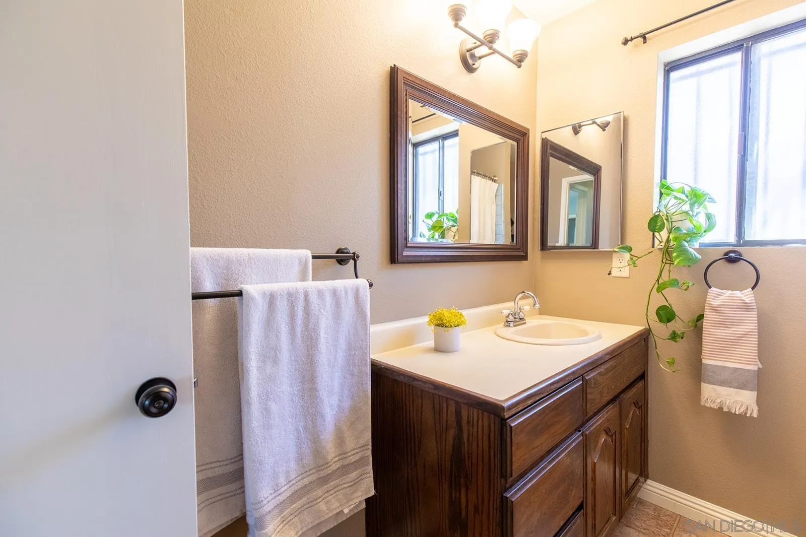 5754 Brandt Road Brawley, CA 92227 - Photo 29 of 48 a bathroom with a sink and a mirror