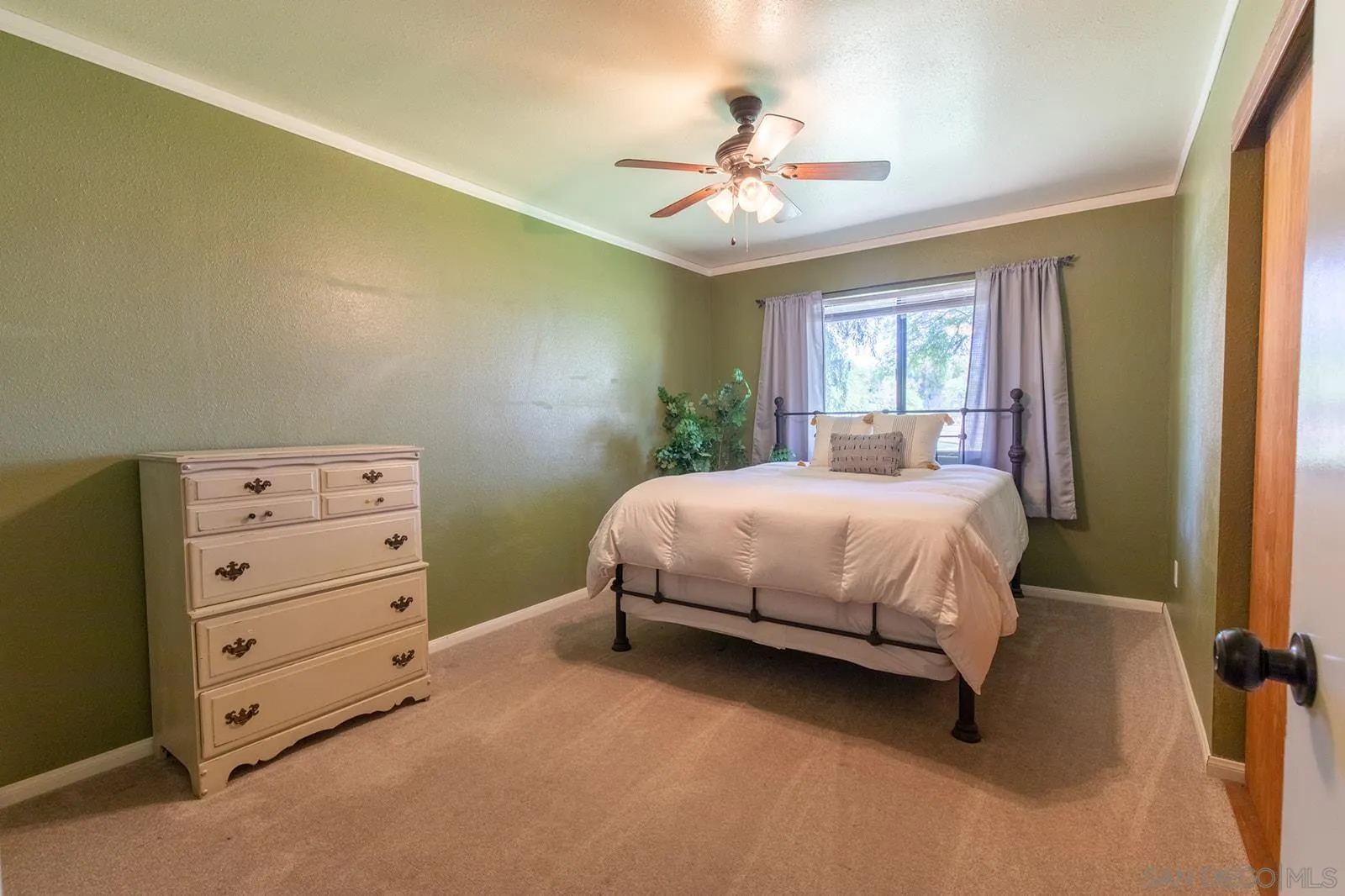 5754 Brandt Road Brawley, CA 92227 - Photo 30 of 48 a bedroom with a bed and a chandelier