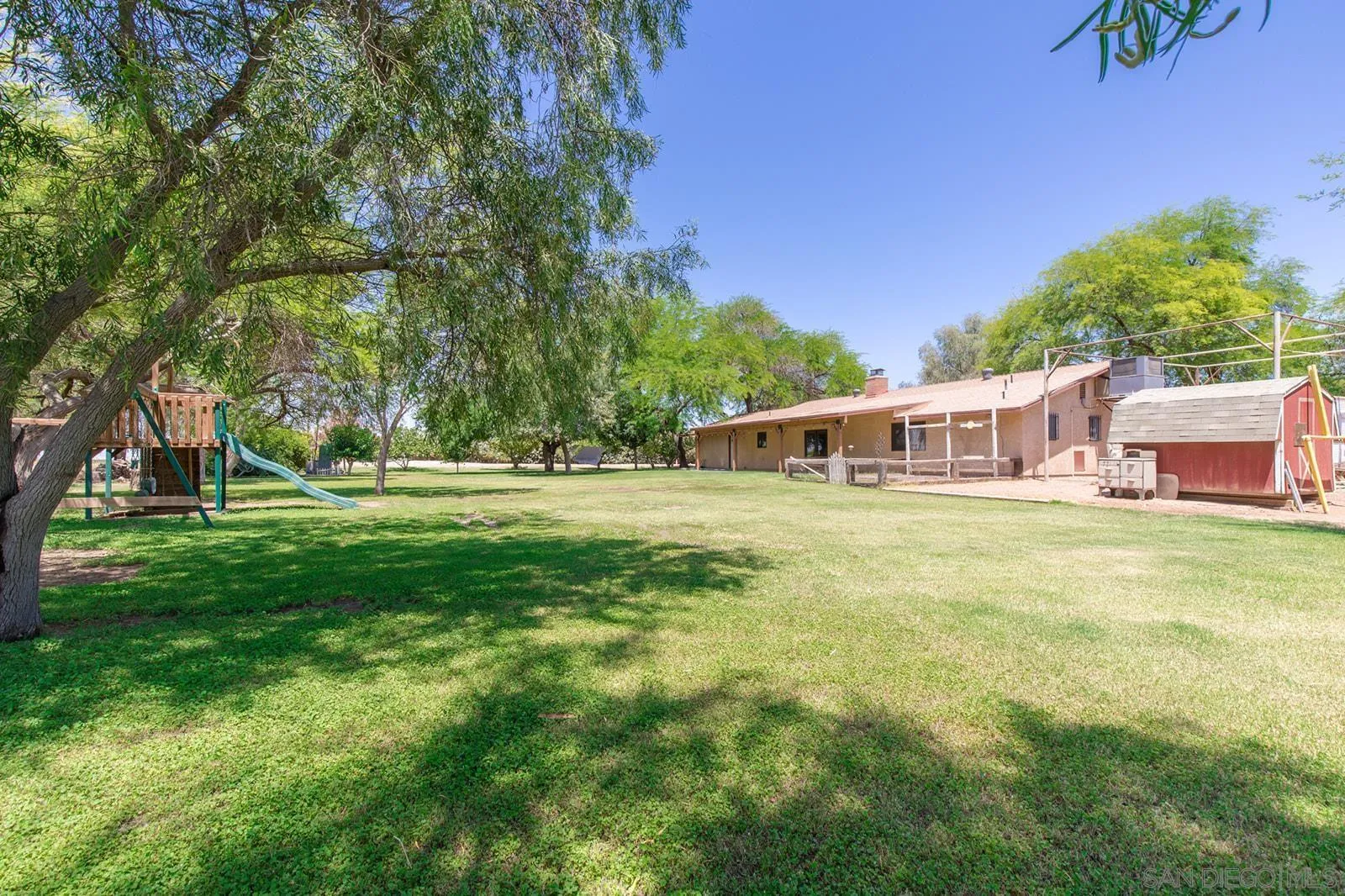 5754 Brandt Road Brawley, CA 92227 - Photo 45 of 48 a front view of house with yard and trees