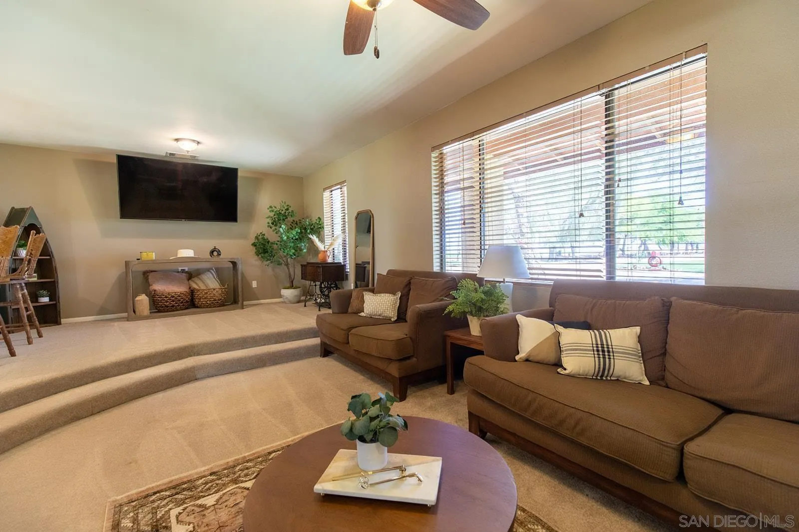 5754 Brandt Road Brawley, CA 92227 - Photo 6 of 48 a living room with furniture and a flat screen tv