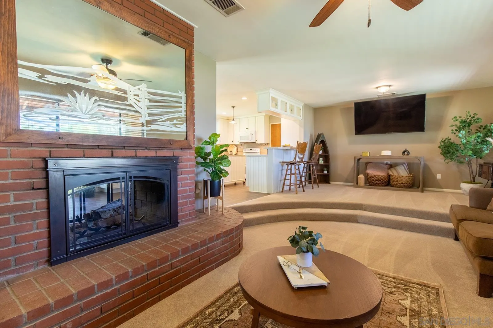 5754 Brandt Road Brawley, CA 92227 - Photo 7 of 48 a living room with furniture a fireplace and a flat screen tv