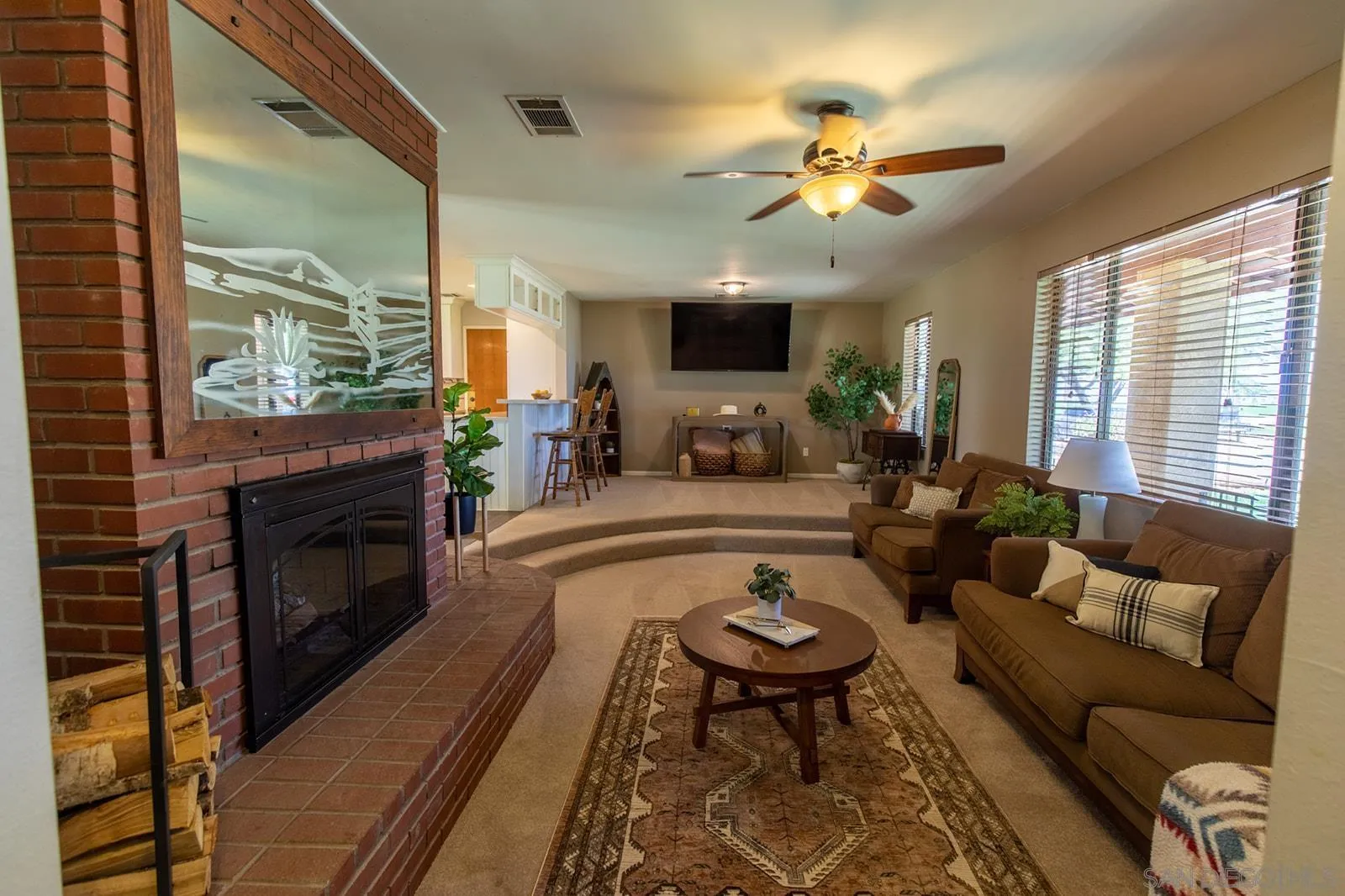 5754 Brandt Road Brawley, CA 92227 - Photo 8 of 48 a living room with furniture fireplace and a large window