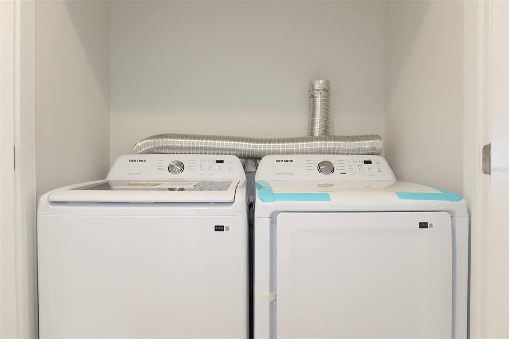 4240 Floramar Terrace New Port Richey, FL 34652 - Photo 21 of 51 a utility room with dryer and washer