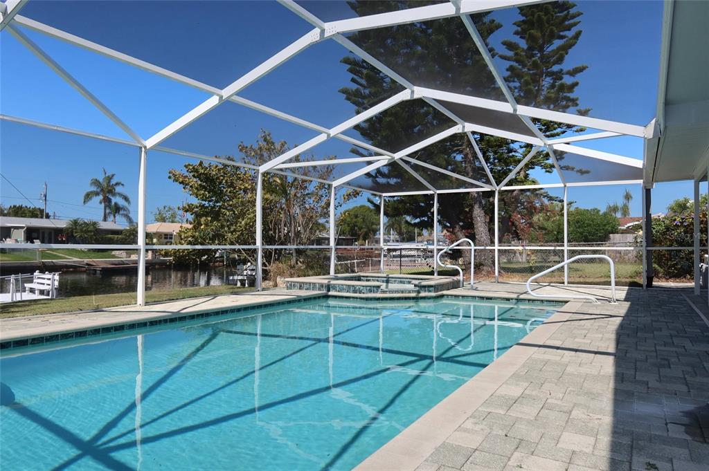 4240 Floramar Terrace New Port Richey, FL 34652 - Photo 25 of 51 a view of a backyard with sitting area