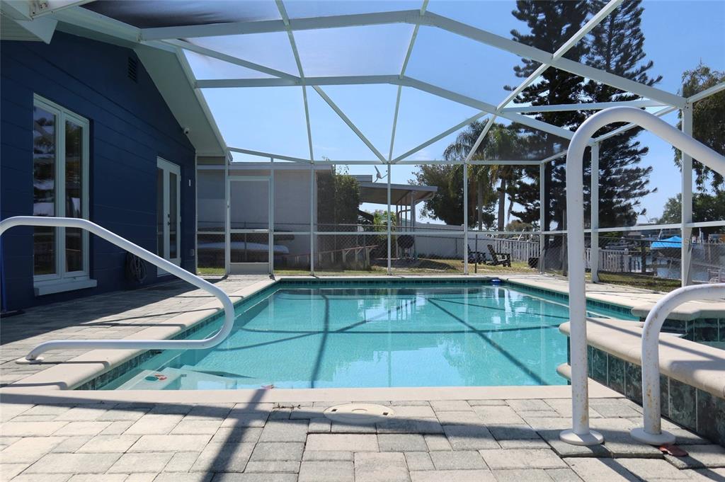 4240 Floramar Terrace New Port Richey, FL 34652 - Photo 29 of 51 a view of a backyard with sitting area and tub