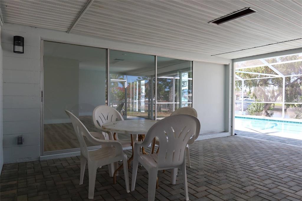4240 Floramar Terrace New Port Richey, FL 34652 - Photo 30 of 51 a dining room with furniture and window