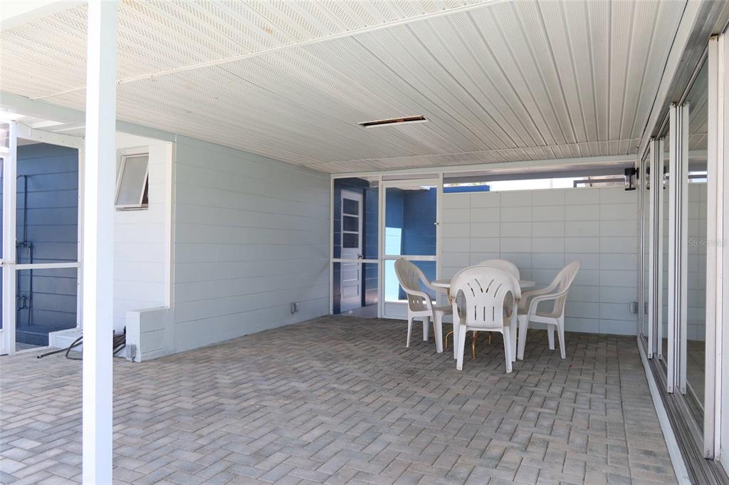 4240 Floramar Terrace New Port Richey, FL 34652 - Photo 31 of 51 a dining room with furniture and wooden floor