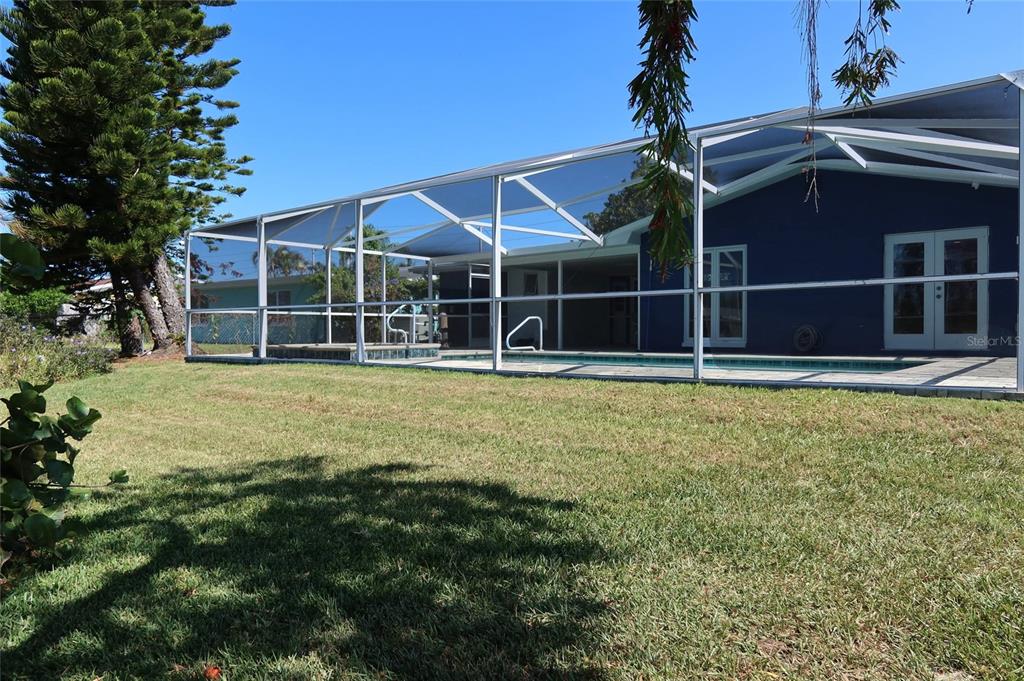 4240 Floramar Terrace New Port Richey, FL 34652 - Photo 36 of 51 a view of a house with a yard