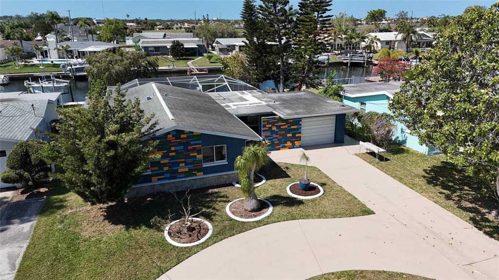 4240 Floramar Terrace New Port Richey, FL 34652 - Photo 43 of 51 an aerial view of a house with outdoor space