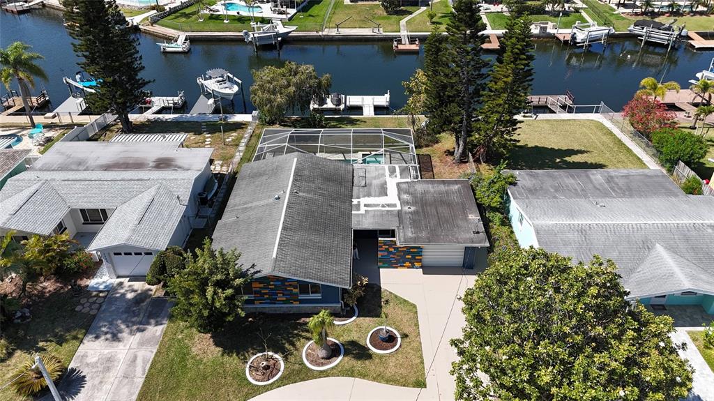 4240 Floramar Terrace New Port Richey, FL 34652 - Photo 46 of 51 an aerial view of a house with swimming pool
