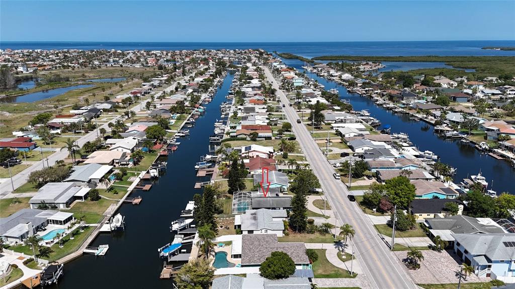 4240 Floramar Terrace New Port Richey, FL 34652 - Photo 47 of 51 an aerial view of residential houses with outdoor space