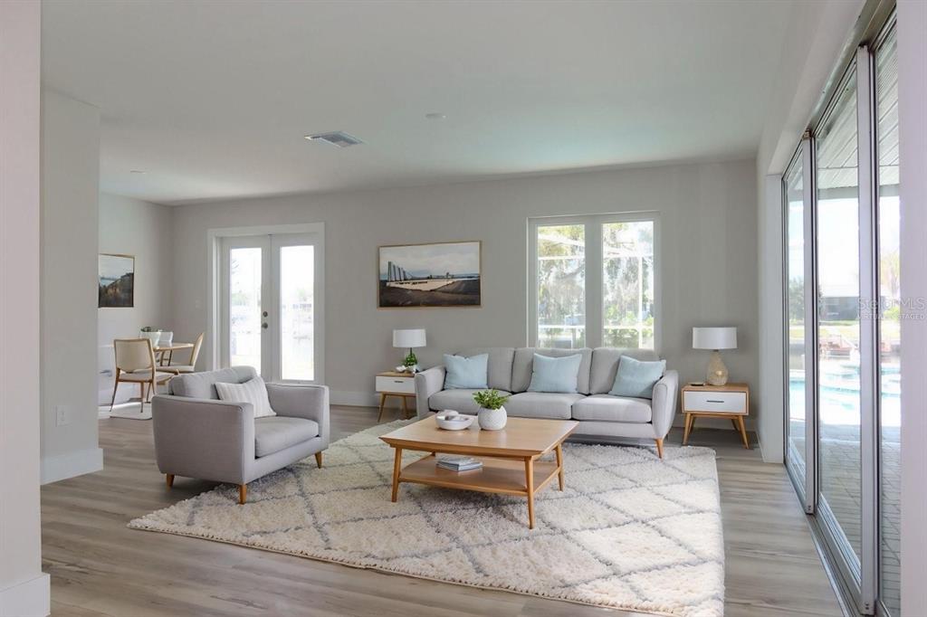 4240 Floramar Terrace New Port Richey, FL 34652 - Photo 5 of 51 a living room with furniture and a large window