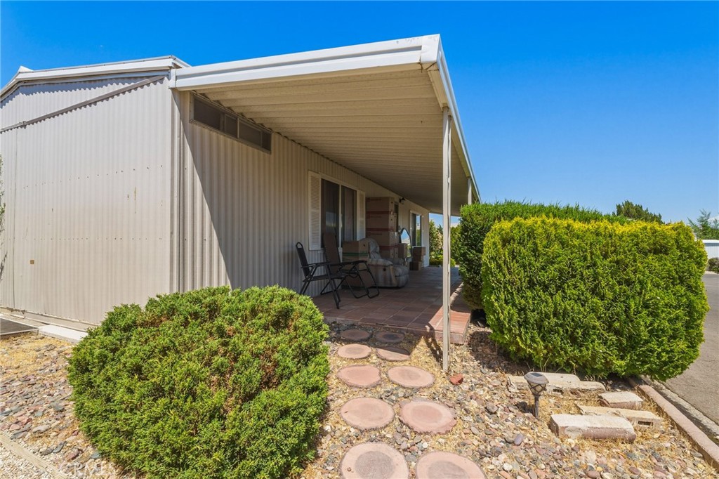 20683 Waalew Road, Unit B201 Apple Valley, CA 92307 - Photo 23 of 32 a view of a house with a garden