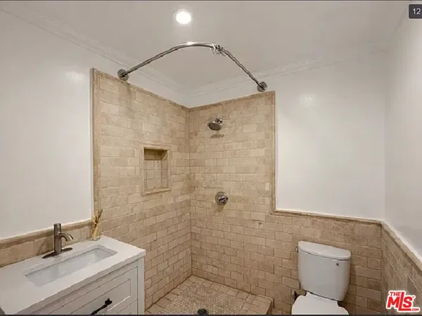 a bedroom with a bed and a table