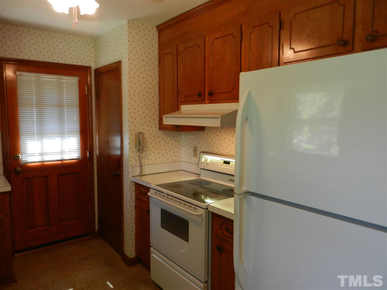 2808 Orkney Place Raleigh, NC 27604 - Photo 6 of 25 a kitchen with a stove and a refrigerator