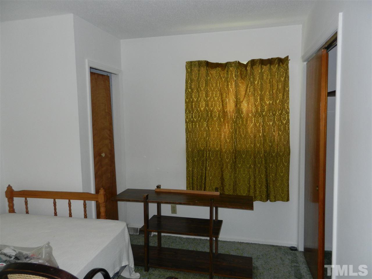 2808 Orkney Place Raleigh, NC 27604 - Photo 9 of 25 a bedroom with a bed and a window