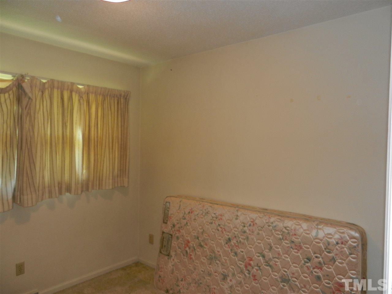 2808 Orkney Place Raleigh, NC 27604 - Photo 10 of 25 a view of a room with wooden floor and a window