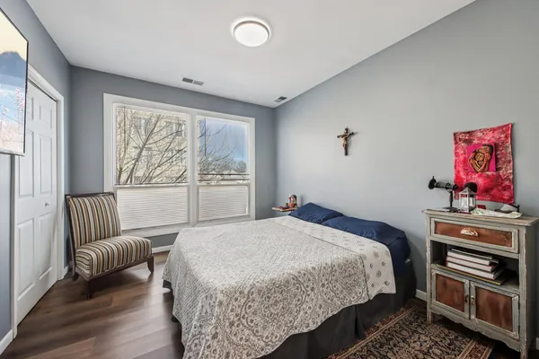 a bedroom with a bed and a couch