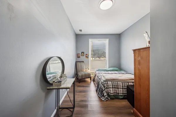 a bedroom with bed and a window