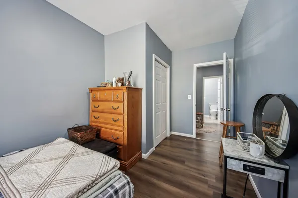 a bed room with a bed and furniture