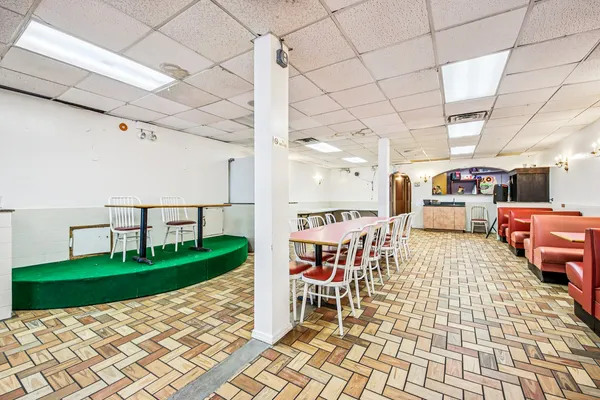 a room with lots of chairs and a table