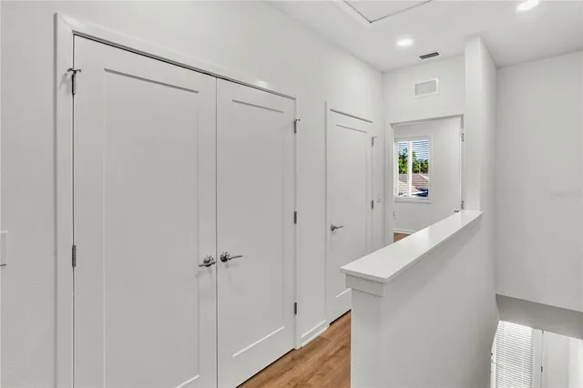 a view of a hallway with closet