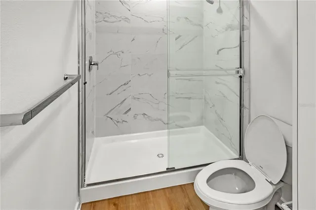 a bathroom with a bathtub and a toilet